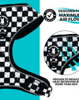 Cooling dog harness in black and white checkered pattern designed for airflow and proven to reduce heat retention by over 85%