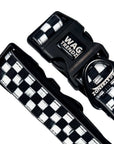 Reflective dog collar with black and white checkered design and branded buckle
