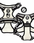 Two NeoCool™ Sport Dog Harnesses With Handle in white with black and gray accents with visible branding and a 'Patent Pending' logo on a white background.
