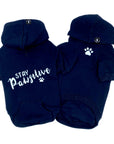 Hooded Sweatshirt For Dogs - "Stay Pawsitive" hooded sweatshirt in black set - back view Stay Pawsitive with paw print front view with paw print - against solid white background - Wag Trendz