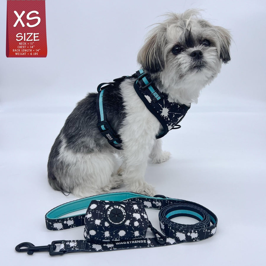 Dog Harness Vest - No Pull - Shih Tzu mix wearing black adjustable harness - white paint splatter and teal accents with matching dog leash and poo bag holder  - against a solid white background - Wag Trendz