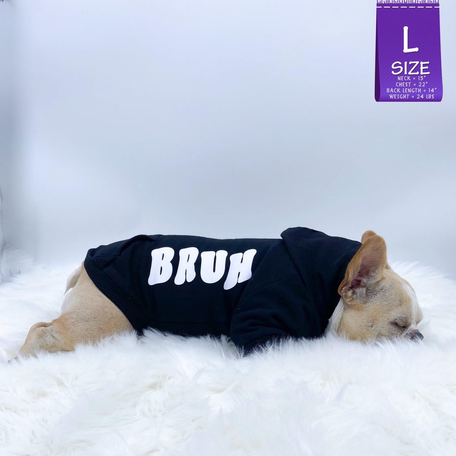Dog Hoodie - Hoodies For Dogs - French Bulldog wearing "BRUH" dog hoodie in black with white letters down the side - laying down sleeping on a white furry rug - against solid white background - Wag Trendz