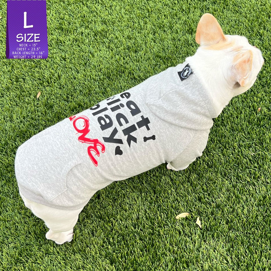 Dog hoodie - Hoodies For Dogs - French Bulldog wearing Valentine "eat lick play LOVE" graphic dog hoodie - back view gray with black lettering and red accents on the hoodie - standing outdoors in the grass - Wag Trendz