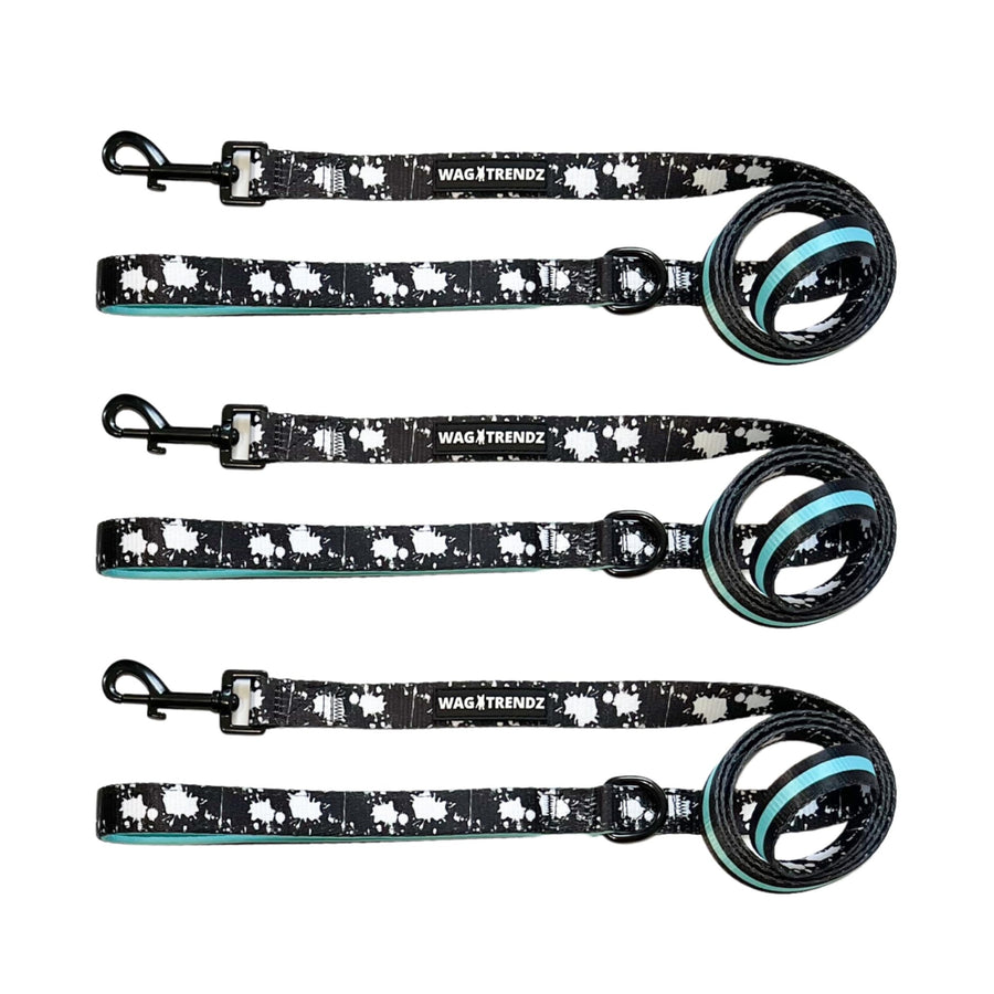 Nylon Dog Leash - three dog leashes laying in a row - black with white paint splatter and contrasting teal accents on backside of the leash laying - against a solid white background - Wag Trendz