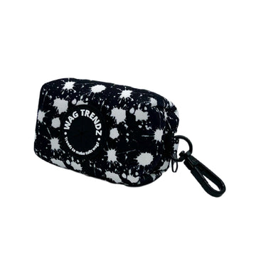 Dog Poo Bag Holder - black with white paint splatter and Wag Trendz rubber logo against white background -- Wag Trendz