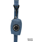 Dog Poop Bag Holder - Downtown Denim - hanging on a denim dog leash with the black rubber logo dispenser on front - against a solid white background - Wag Trendz