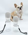 Dog Portable Water Bottle - white with black & white logo strap - large and small with French Bulldog in the background against solid white background - Wag Trendz