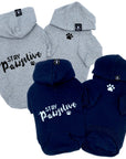 Hooded Sweatshirts For Dogs - "Stay Pawsitive" hooded sweatshirt in gray and black sets - back view Stay Pawsitive with paw print front view with paw print - against solid white background - Wag Trendz