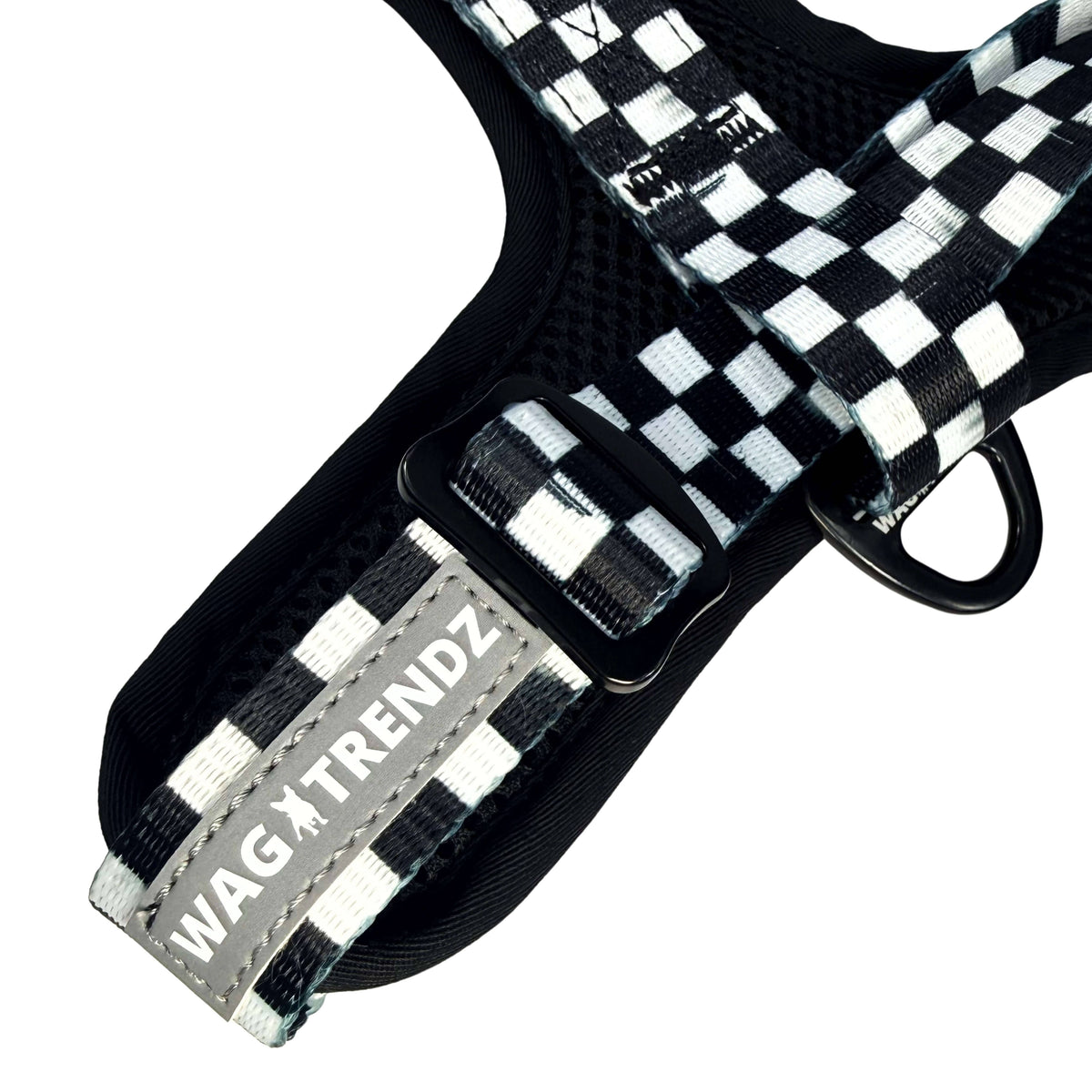 Cooling dog harness with adjustable black and white checkered strap and reflective Wag Trendz® brand label