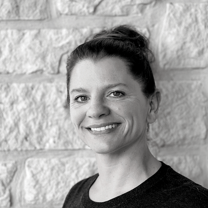 About us - Meet the Pack Female Co-Founder Sarah Head Shot in black & white against white rock wall - Wag Trendz