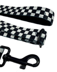 Adjustable dog leash with checkered strap and black metal clasp