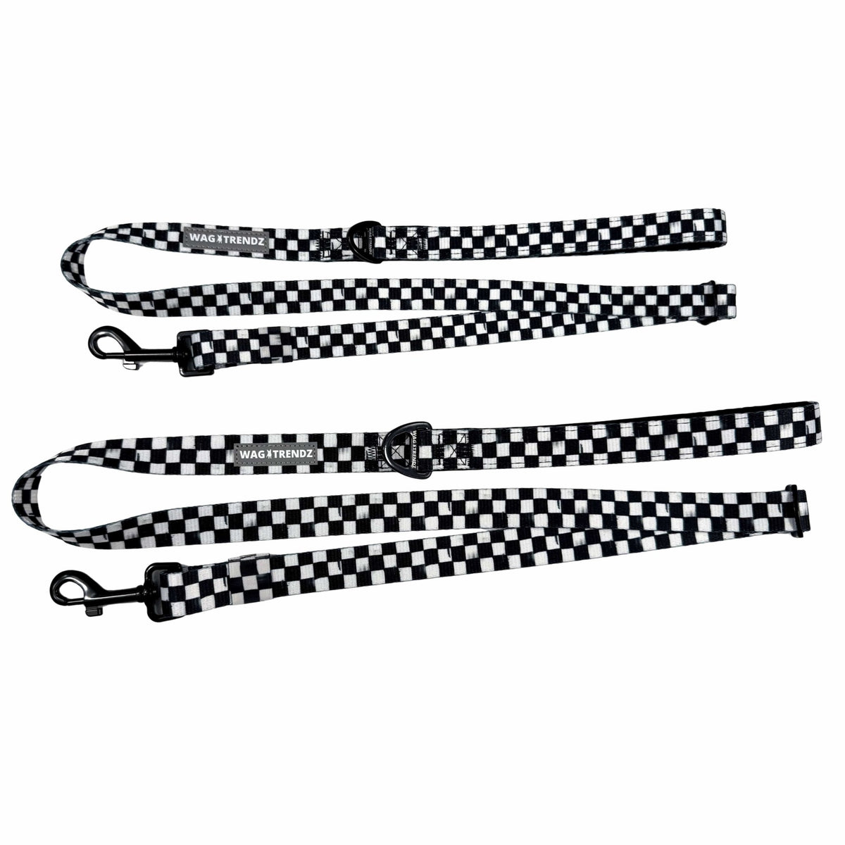 Adjustable dog leashes in messy black and white checkered with black clasps and reflective Wag Trendz® labels