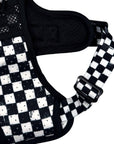 Cooling dog harness with handle, air mesh padding, breathable holdes in a black and white checkered design and black metal strap adjuster