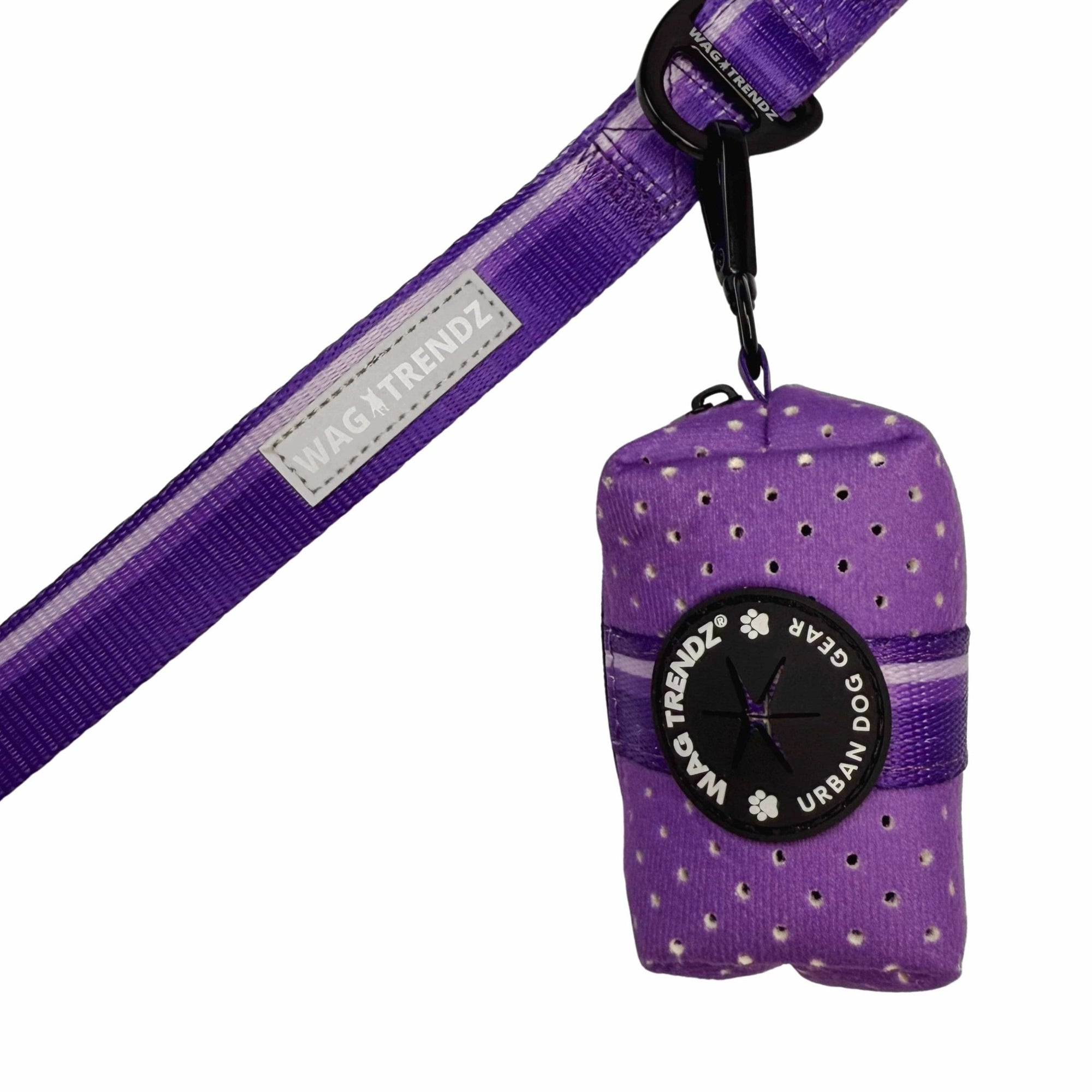 NeoCool™ Sport Poop Bag Holder in purple logo dispenser hanging on purple dog leash with white background