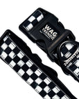 Reflective dog collar with black and white checkered design and branded buckle
