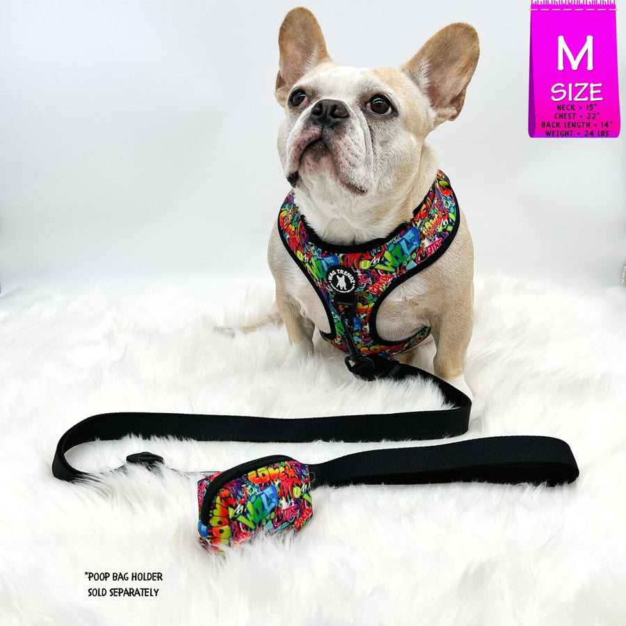 Adjustable Dog Leash - Black with multi-colored graffiti harness worn by cute fawn colored Frenchie Bulldog against a solid white background with black leash and graffiti poop bag holder attached - Wag Trendz