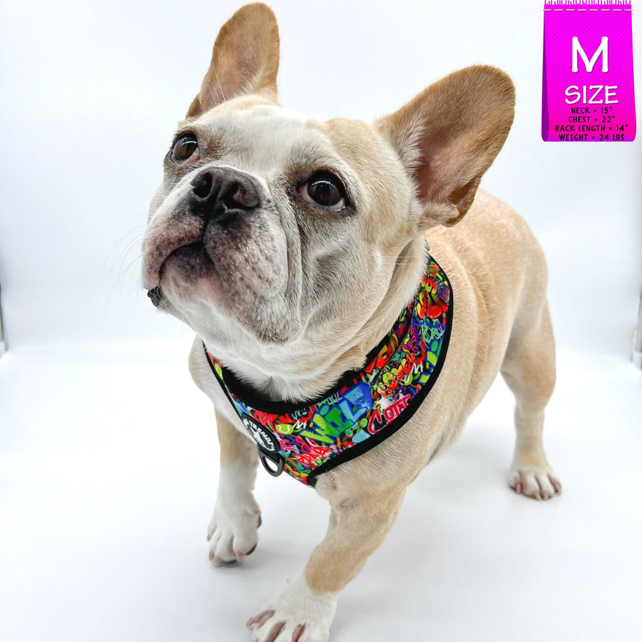 Dog Harness Vest - Adjustable - Front Clip - worn by cute fawn colored Frenchie Bulldog against solid white background - wearing multi-colored street graffiti design - Wag Trendz