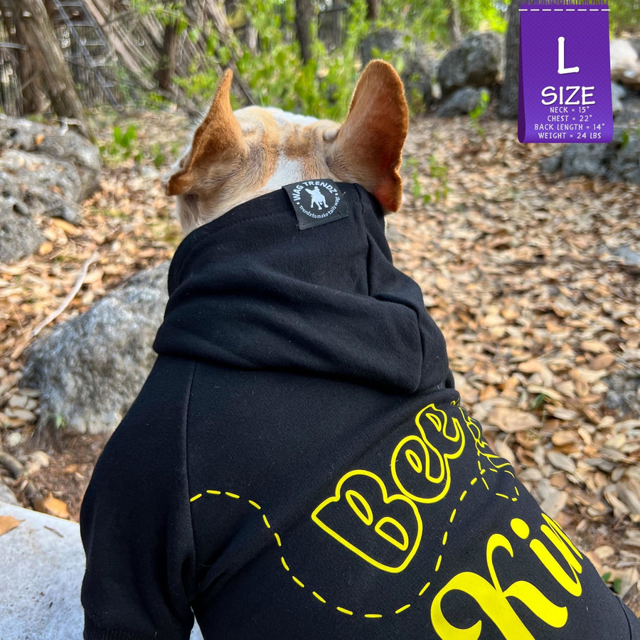 Dog Hoodie - Hoodies For Dogs - French Bulldog wearing "Bee Kind" dog hoodie in black with Bee Kind in yellow - sitting with back to camera outdoors against a fall background - Wag Trendz