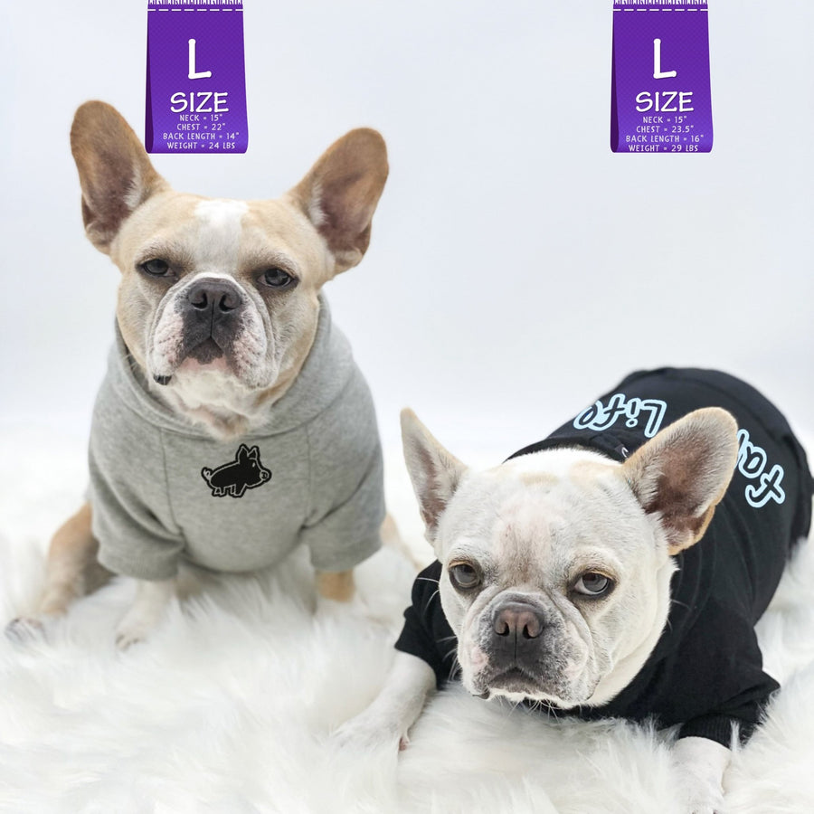 Dog Hoodie - Hoodies For Dogs - Two French Bulldogs wearing "Farm Life" dog hoodies in black and gray - one sitting up and one laying down - front view with cute pig - against a solid white background - Wag Trendz
