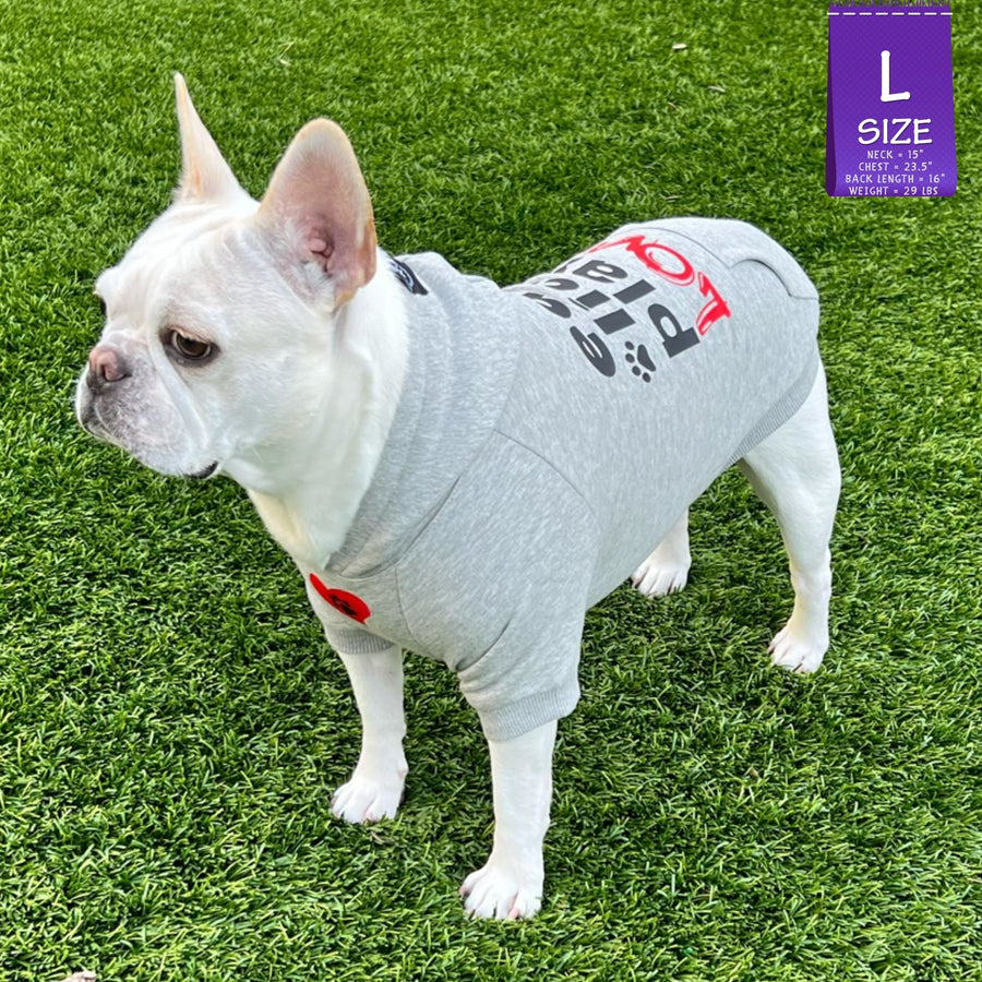 Dog hoodie - Hoodies For Dogs - French Bulldog wearing Valentine "eat lick play LOVE" dog hoodie - gray with red heart and black paw emoji on the front - standing outdoors in the grass - Wag Trendz
