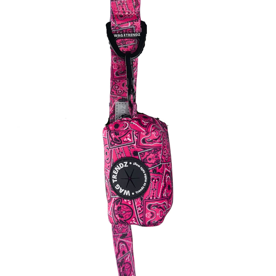 Dog Poo Bag Holder - Bandana Boujee - Hot Pink with black zipper and black rubber logo dispenser on front hanging on a matching leash - against a solid white background - Wag Trendz