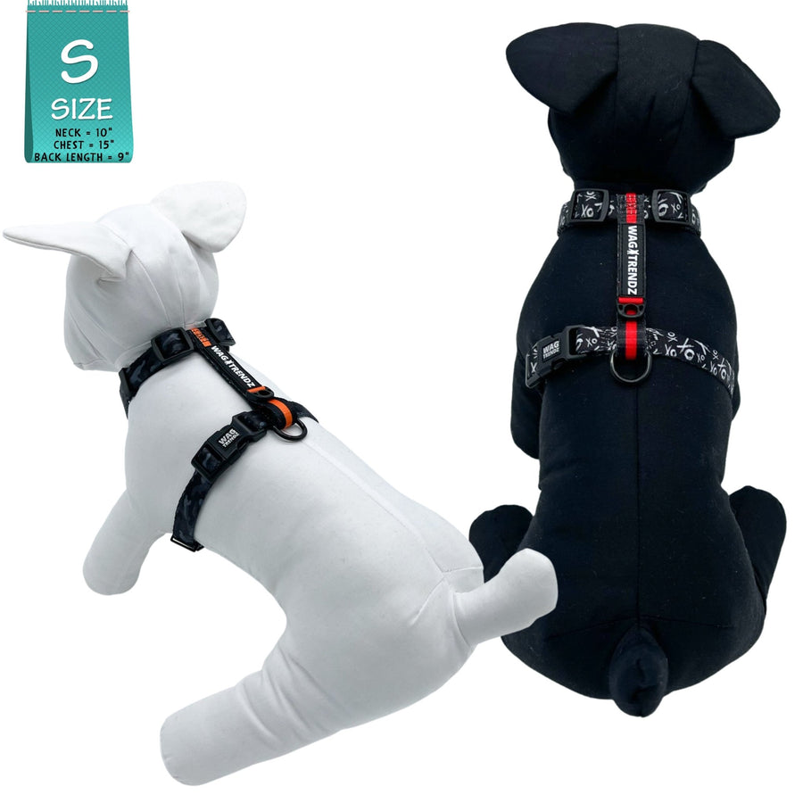 H Dog Harness - Roman Dog Harness - worn by two stuffed dogs (one black & one white) wearing black and white XO pattern dog harness with red accents - against a solid white background - Wag Trendz