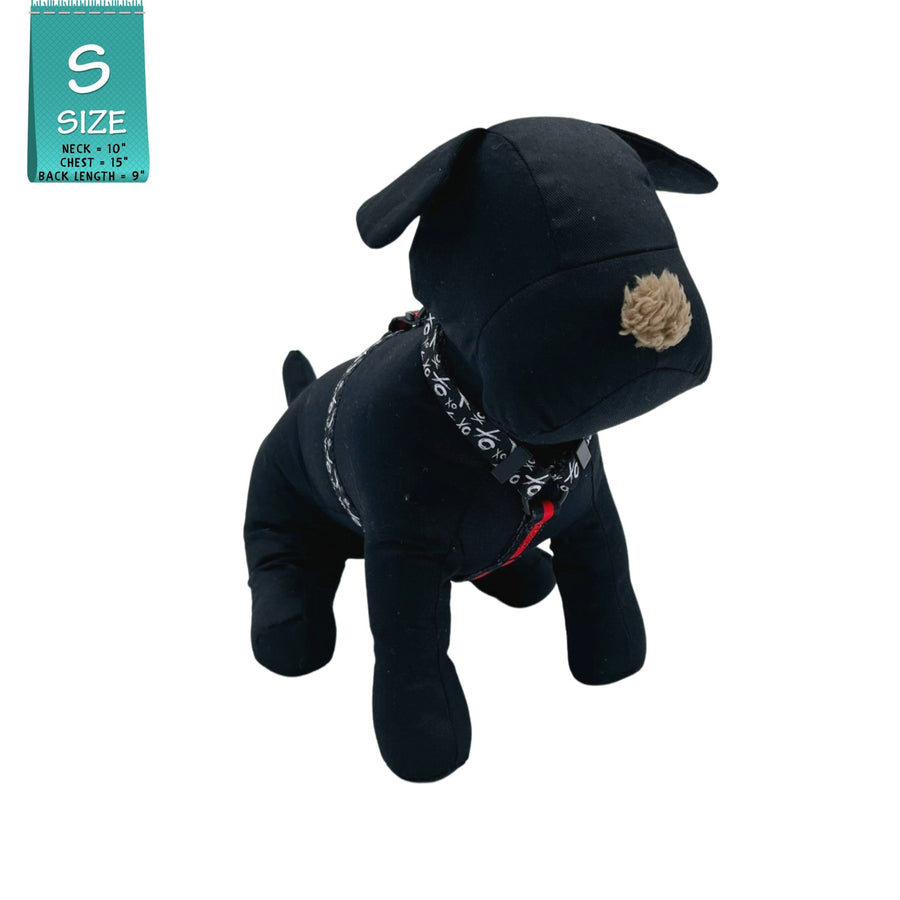 H Dog Harness - Roman Dog Harness - worn by black stuffed dog wearing black and white XO pattern harness with red accents - front view - against a solid white background - Wag Trendz
