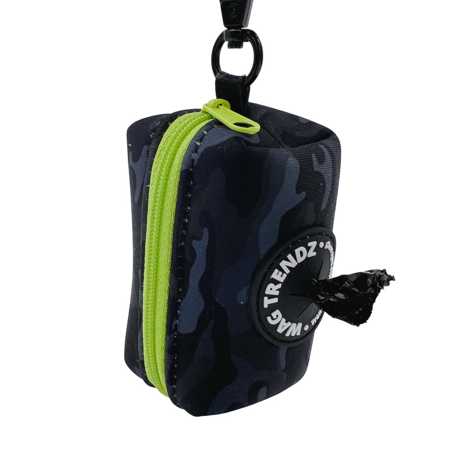 Dog Poo Bag Holder - black and gray camo design with a hi-vis zipper and black rubber logo dispenser on front - hanging against a solid white background - Wag Trendz